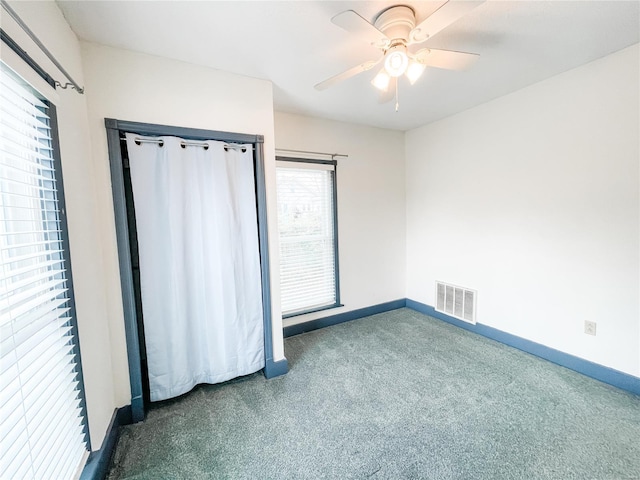 791 E Adams St, Nashville, IL 62263 - unfurnished bedroom with carpet floors, baseboards, and ceiling fan