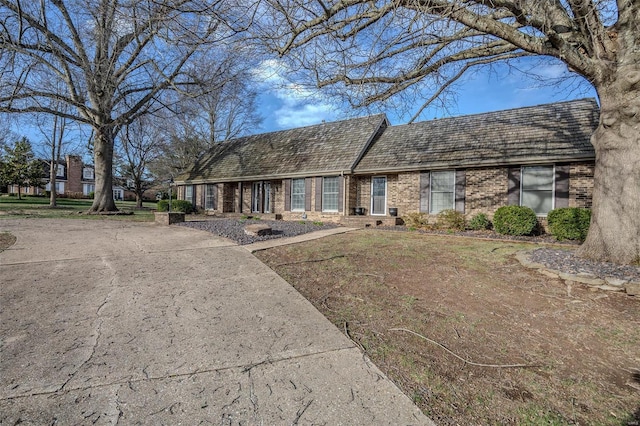 view of front of home with brick siding