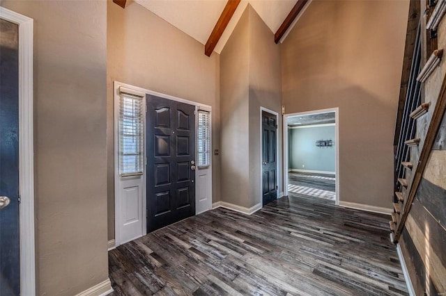 entryway featuring dark wood-type flooring, high vaulted ceiling, baseboards, and beamed ceiling
