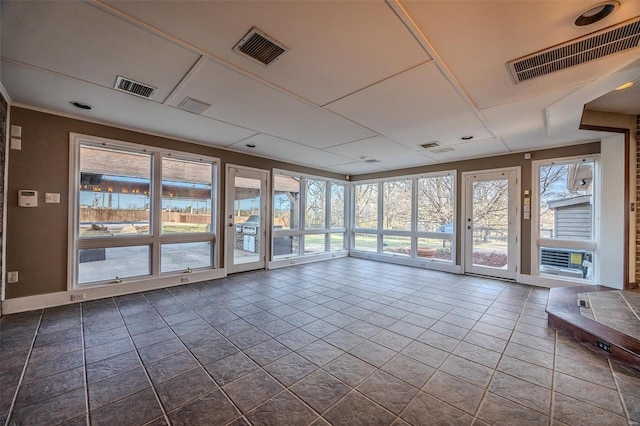 unfurnished room featuring baseboards