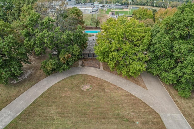 view of property location featuring a pool