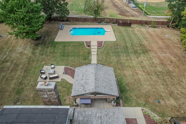 aerial view of property and surrounding area featuring a pool area