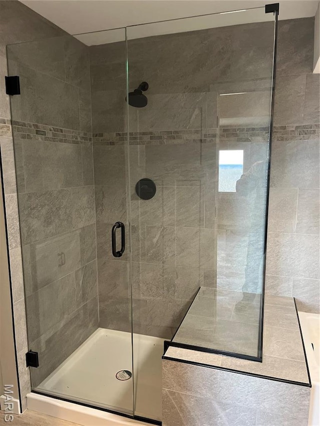bathroom with a stall shower