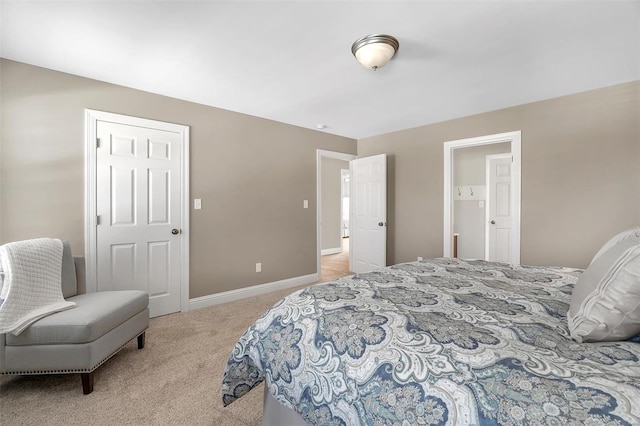 carpeted bedroom with baseboards