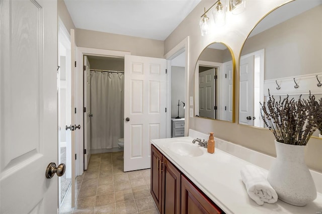 bathroom with vanity, toilet, and a shower with shower curtain