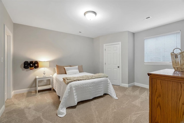 bedroom featuring carpet floors and baseboards