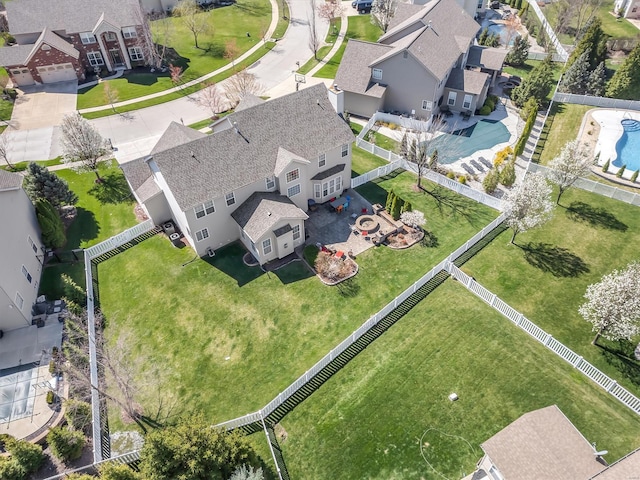 aerial perspective of suburban area featuring a pool