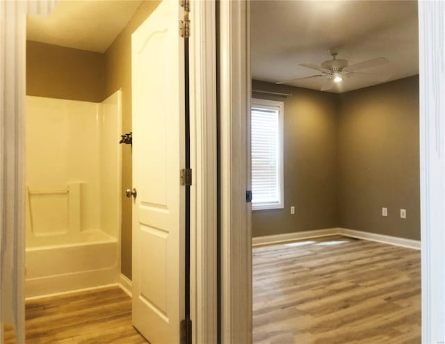 interior space featuring light wood-style floors and baseboards