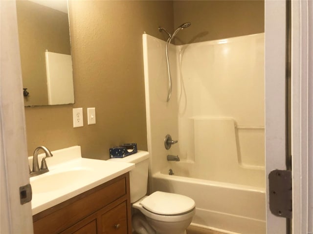 bathroom featuring vanity, toilet, and bathing tub / shower combination