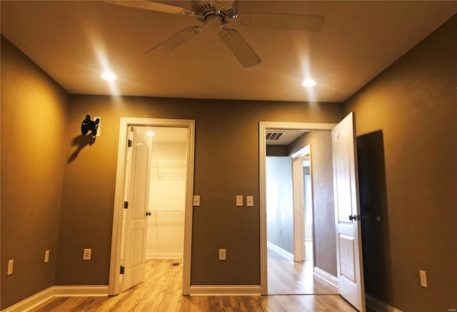 unfurnished bedroom featuring light wood finished floors, baseboards, recessed lighting, and ceiling fan