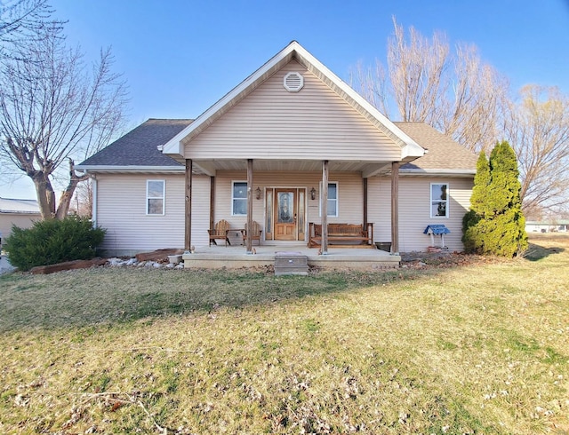 104 E Bryan St, Ewing, MO 63440 - back of house featuring a yard, a porch, and roof with shingles