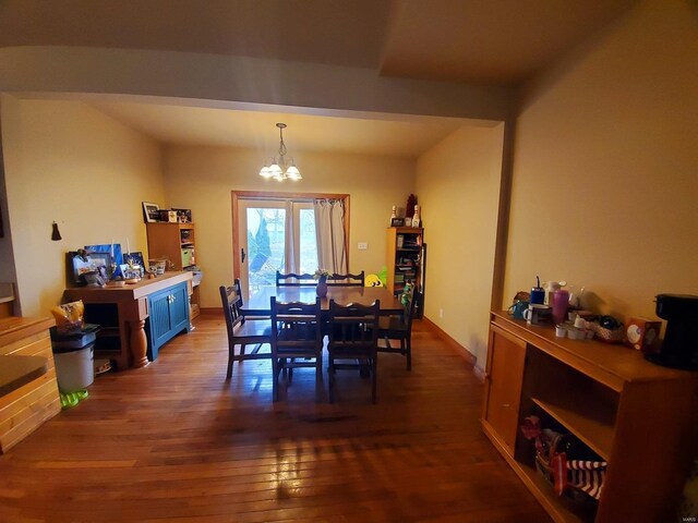 104 E Bryan St, Ewing, MO 63440 - dining room featuring a chandelier and dark wood-style flooring