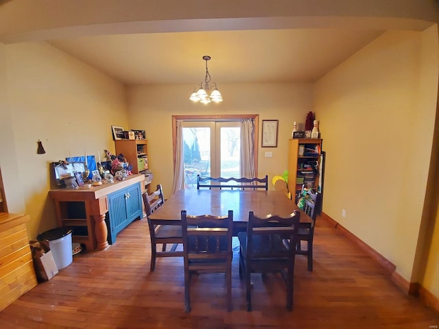 104 E Bryan St, Ewing, MO 63440 - dining space with a chandelier, light wood finished floors, and baseboards
