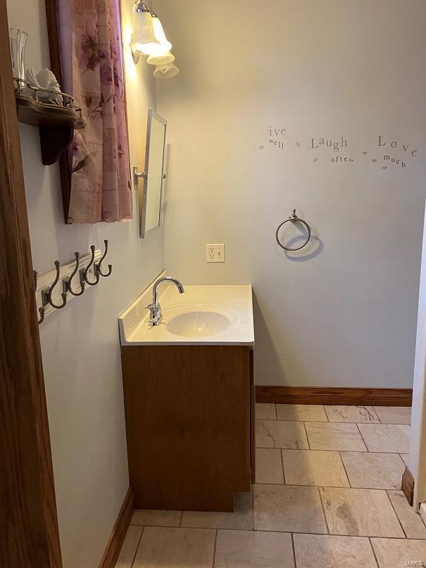 104 E Bryan St, Ewing, MO 63440 - bathroom with vanity and baseboards
