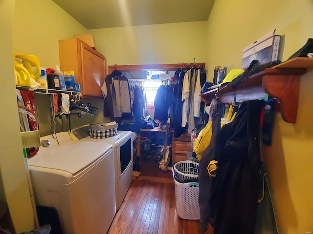 104 E Bryan St, Ewing, MO 63440 - clothes washing area with washing machine and dryer, cabinet space, and wood-type flooring