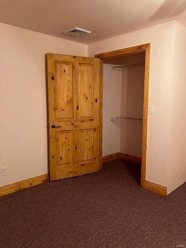 104 E Bryan St, Ewing, MO 63440 - unfurnished bedroom featuring carpet floors and baseboards
