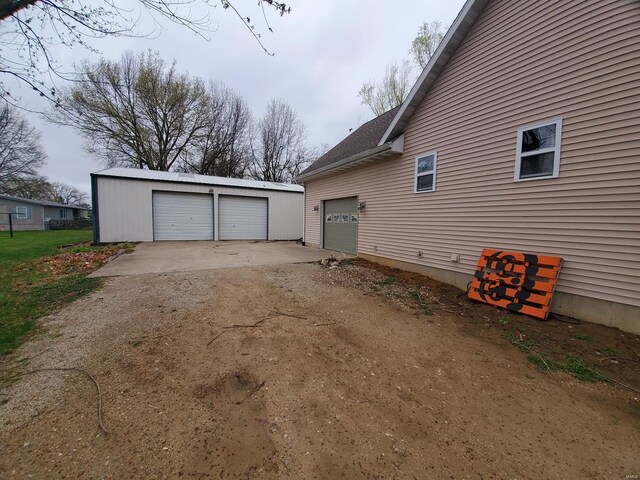 104 E Bryan St, Ewing, MO 63440 - view of property exterior with a garage