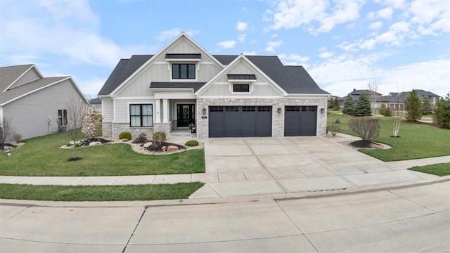 7121 Lost Oak Dr, Edwardsville, IL 62025 - view of front of property with board and batten siding, stone siding, concrete driveway, and a front lawn