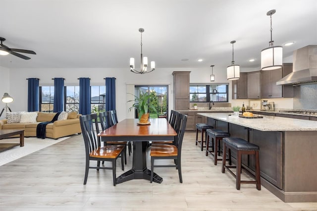 7121 Lost Oak Dr, Edwardsville, IL 62025 - dining area with light wood-style floors, recessed lighting, a chandelier, and a ceiling fan