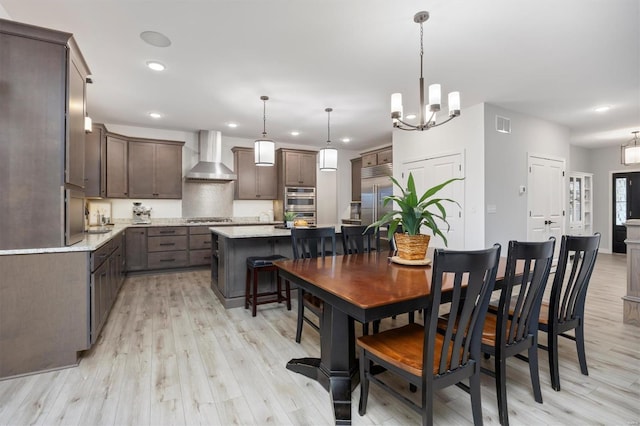 7121 Lost Oak Dr, Edwardsville, IL 62025 - dining space with light wood-style floors, recessed lighting, and a chandelier