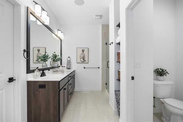 7121 Lost Oak Dr, Edwardsville, IL 62025 - bathroom with toilet, a stall shower, double vanity, and baseboards