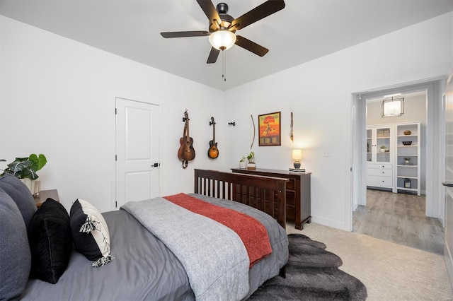 7121 Lost Oak Dr, Edwardsville, IL 62025 - bedroom with a ceiling fan, light carpet, and baseboards