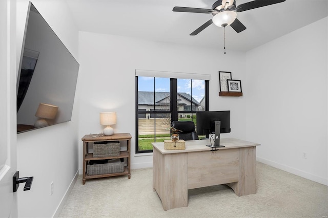 7121 Lost Oak Dr, Edwardsville, IL 62025 - home office with ceiling fan, light colored carpet, and baseboards
