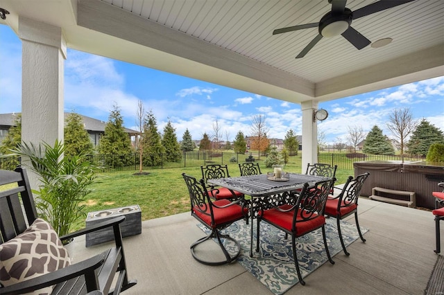 7121 Lost Oak Dr, Edwardsville, IL 62025 - view of patio / terrace with a hot tub, outdoor dining space, and a ceiling fan
