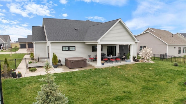 7121 Lost Oak Dr, Edwardsville, IL 62025 - back of house featuring a hot tub, a patio area, and a shingled roof