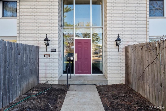10469 Briarbend Dr Unit 4, Saint Louis, MO 63146 - doorway to property with brick siding and fence