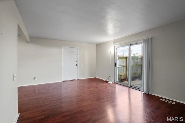 10469 Briarbend Dr Unit 4, Saint Louis, MO 63146 - unfurnished room featuring wood finished floors and baseboards