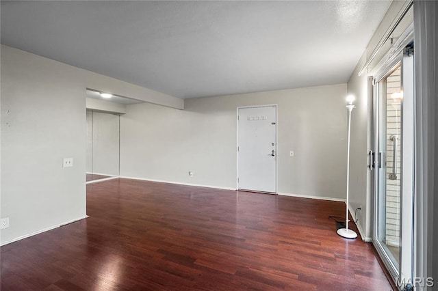 10469 Briarbend Dr Unit 4, Saint Louis, MO 63146 - empty room featuring wood finished floors and baseboards