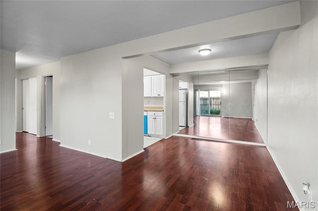 10469 Briarbend Dr Unit 4, Saint Louis, MO 63146 - unfurnished living room with wood finished floors and baseboards