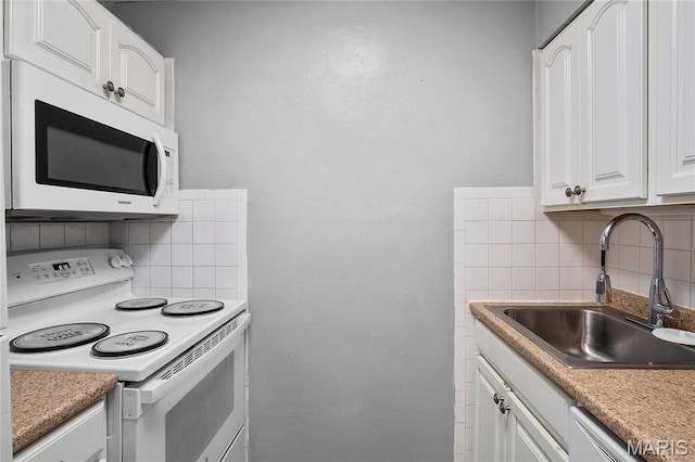10469 Briarbend Dr Unit 4, Saint Louis, MO 63146 - kitchen featuring white appliances, decorative backsplash, a sink, white cabinets, and light countertops