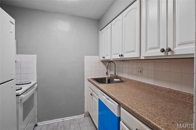 10469 Briarbend Dr Unit 4, Saint Louis, MO 63146 - kitchen featuring white appliances, a sink, white cabinets, and tasteful backsplash