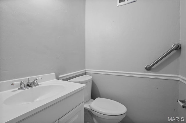 10469 Briarbend Dr Unit 4, Saint Louis, MO 63146 - half bathroom featuring toilet and vanity