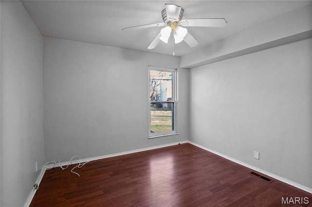 10469 Briarbend Dr Unit 4, Saint Louis, MO 63146 - unfurnished room with dark wood-style flooring, ceiling fan, and baseboards