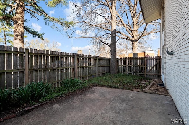 10469 Briarbend Dr Unit 4, Saint Louis, MO 63146 - view of patio featuring a fenced backyard