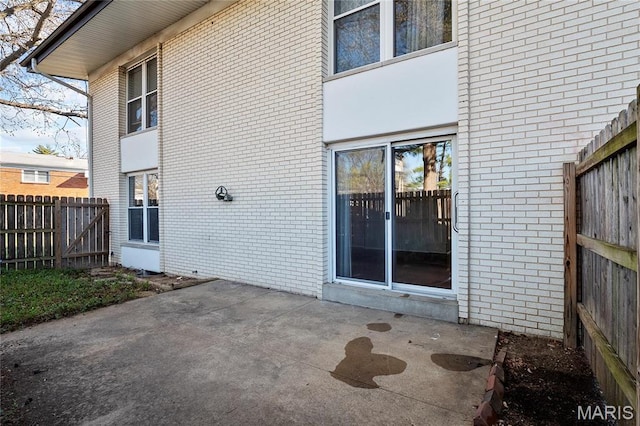 10469 Briarbend Dr Unit 4, Saint Louis, MO 63146 - rear view of property with brick siding, a patio, and fence