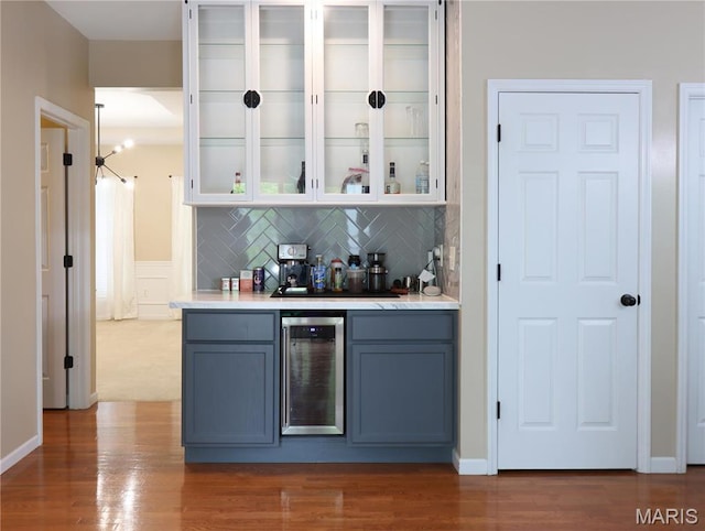 6804 Laurel Springs Ct, Fairview Heights, IL 62208 - indoor wet bar with beverage cooler, backsplash, and wood finished floors