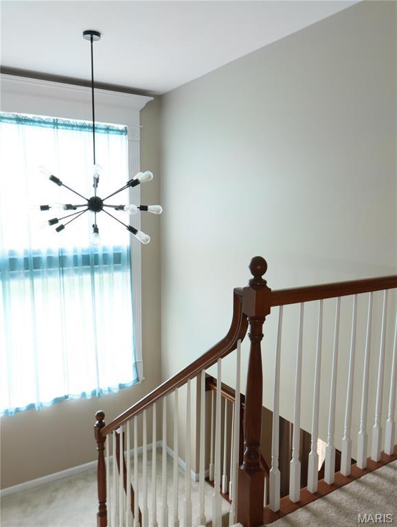 6804 Laurel Springs Ct, Fairview Heights, IL 62208 - stairway with carpet and a chandelier