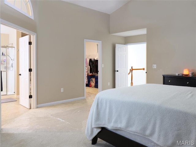 6804 Laurel Springs Ct, Fairview Heights, IL 62208 - bedroom with a walk in closet, carpet, connected bathroom, a closet, and baseboards