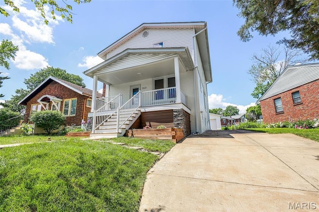 1521 Collins Ave, Saint Louis, MO 63117 - view of front of house featuring a porch, stairs, and a front yard