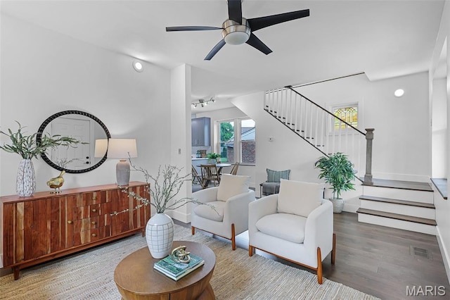 1521 Collins Ave, Saint Louis, MO 63117 - living area featuring stairs, ceiling fan, wood finished floors, and baseboards