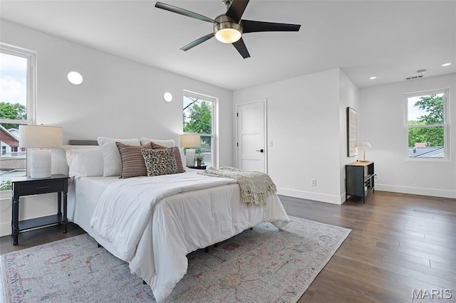 1521 Collins Ave, Saint Louis, MO 63117 - bedroom with multiple windows, baseboards, dark wood finished floors, a ceiling fan, and recessed lighting
