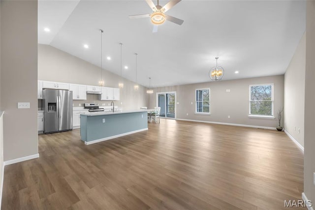 1542 Hickory Lndg, De Soto, MO 63020 - kitchen with appliances with stainless steel finishes, a sink, open floor plan, white cabinets, and light countertops