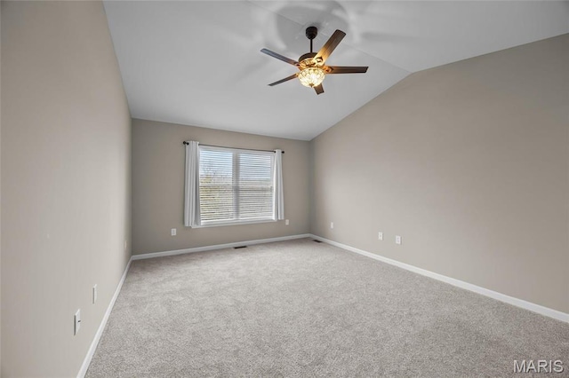 1542 Hickory Lndg, De Soto, MO 63020 - spare room with lofted ceiling, ceiling fan, carpet floors, and baseboards