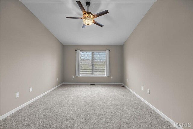 1542 Hickory Lndg, De Soto, MO 63020 - carpeted empty room featuring ceiling fan, vaulted ceiling, and baseboards