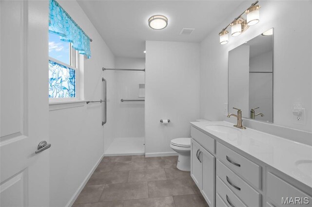 1542 Hickory Lndg, De Soto, MO 63020 - full bathroom with toilet, baseboards, a shower, and double vanity