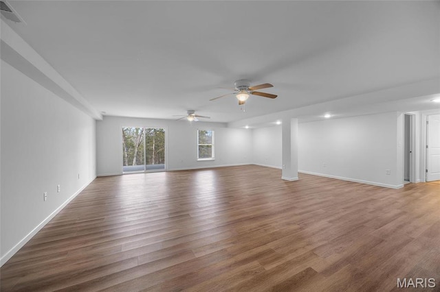 1542 Hickory Lndg, De Soto, MO 63020 - unfurnished living room with ceiling fan, light wood finished floors, and baseboards